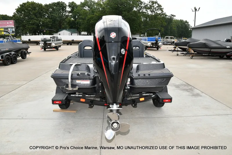 Slide: The Image of The image shows a 2027 Nitro Z19 XL Pro boat on a trailer in an outdoor area. - 28