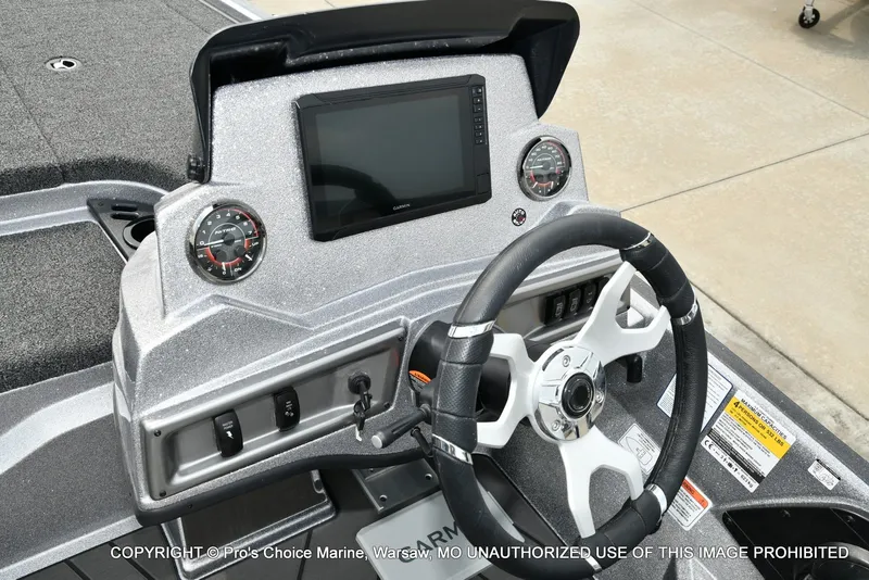 Slide: The Image of The image shows the helm of a Nitro Z19 XL Pro boat with a modern display and instruments. - 46