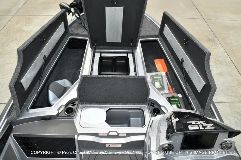 Slide: The Image of The image shows the open storage compartment of a Nitro Z19 XL Pro boat with various gear. - 23