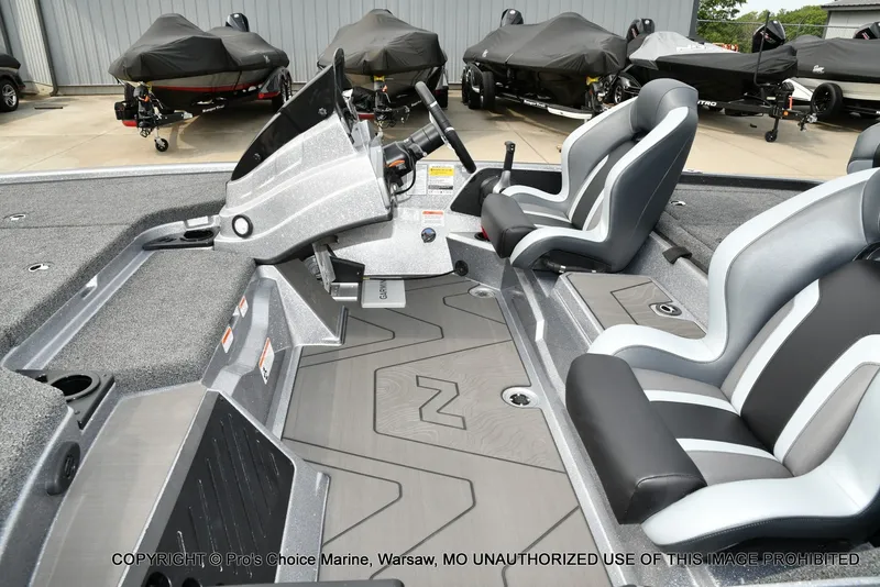Slide: The Image of The image shows the cockpit of a Nitro Z19 XL Pro boat with modern seats and a control console. - 15