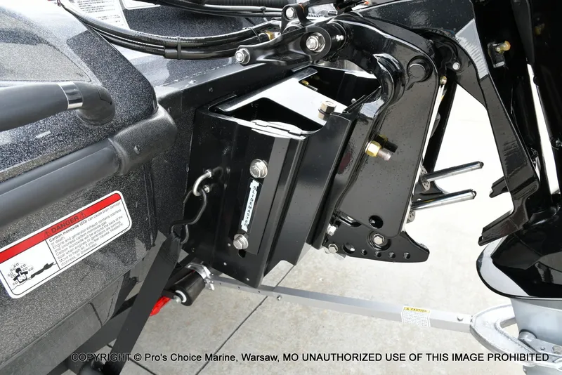 Slide: The Image of Close-up of a boat trailer with mechanical components and a warning label. - 27