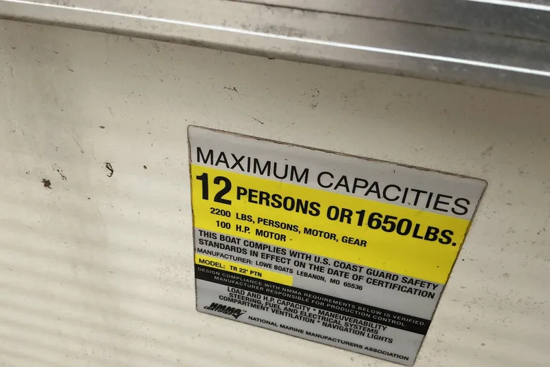 Slide: The Image of Capacity label on 2003 Lowe Trinidad 220 boat, max 12 persons or 1650 lbs. - 16