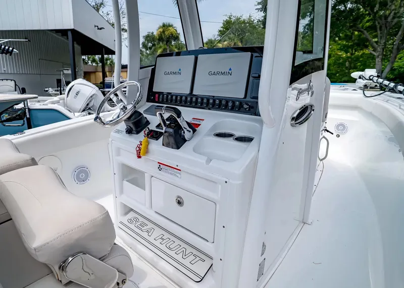 Slide: The Image of The image shows the cockpit of a 2020 Sea Hunt Gamefish 27CB with Garmin electronics. - 20