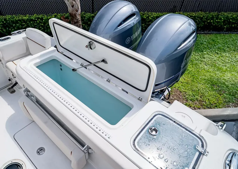 Slide: The Image of The image shows the stern of a 2020 Sea Hunt Gamefish 27CB with two Yamaha engines. - 8