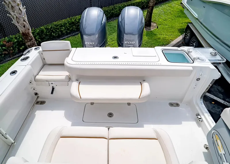 Slide: The Image of The image shows the cockpit of a 2020 Sea Hunt Gamefish 27CB with two engines. - 9