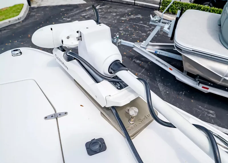 Slide: The Image of A 2020 Sea Hunt Gamefish 27CB with a mounted trolling motor on the deck. - 26