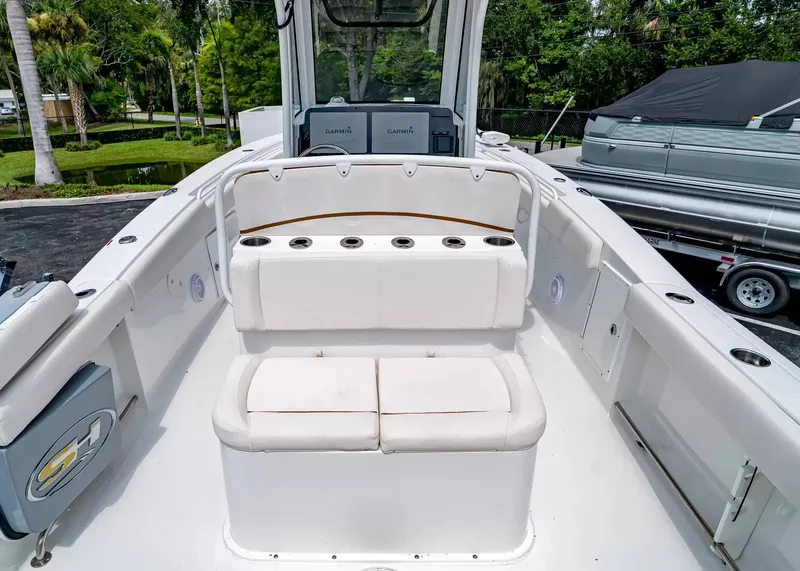 Slide: The Image of The image shows the cockpit of a 2020 Sea Hunt Gamefish 27CB with white upholstery. - 11
