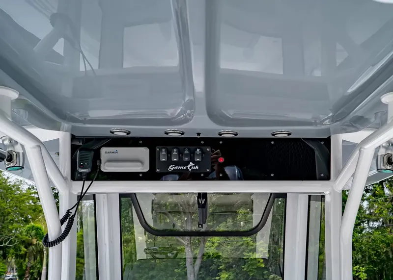 Slide: The Image of The image shows the helm of a 2020 Sea Hunt Gamefish 27CB with electronics and controls. - 17
