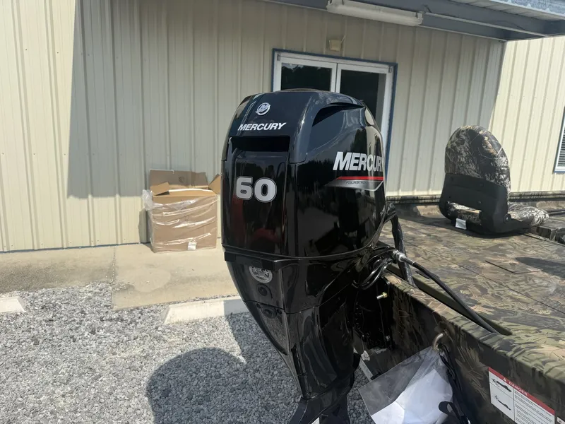 Slide: The Image of A Mercury 60 horsepower outboard motor is attached to a Lowe Roughneck 1650SC boat. - 7