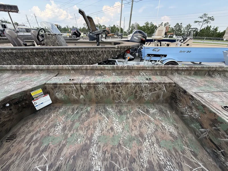 Slide: The Image of The image shows a G3 Gator Tough 15DK boat with a 40HP Yamaha engine, featuring a camouflage design. - 11