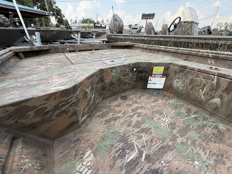 Slide: The Image of The image shows the interior of a G3 Gator Tough 15DK boat with camouflage pattern. - 10