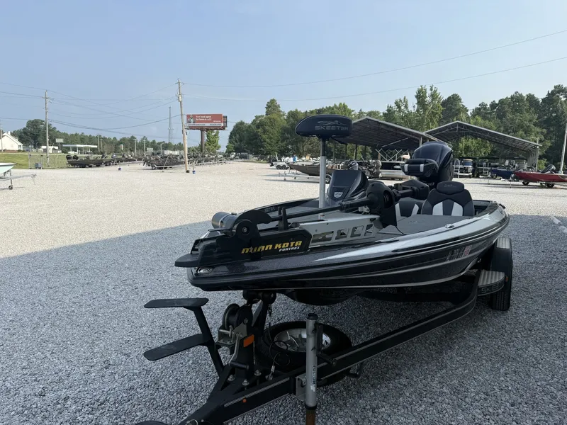Slide: The Image of A 2018 Skeeter ZX200 boat on a trailer in a gravel lot. - 5
