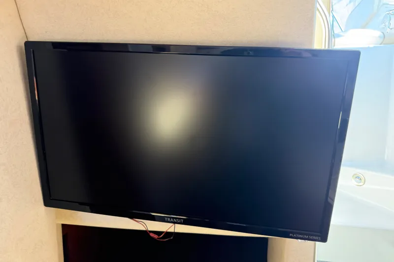 Slide: The Image of Flat-screen TV inside 2013 Sea Ray Sundancer 280 yacht cabin. - 33