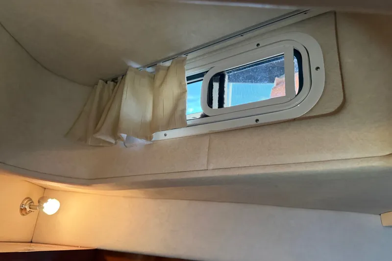 Slide: The Image of Interior cabin window of 2013 Sea Ray Sundancer 280 boat with curtain and light. - 36