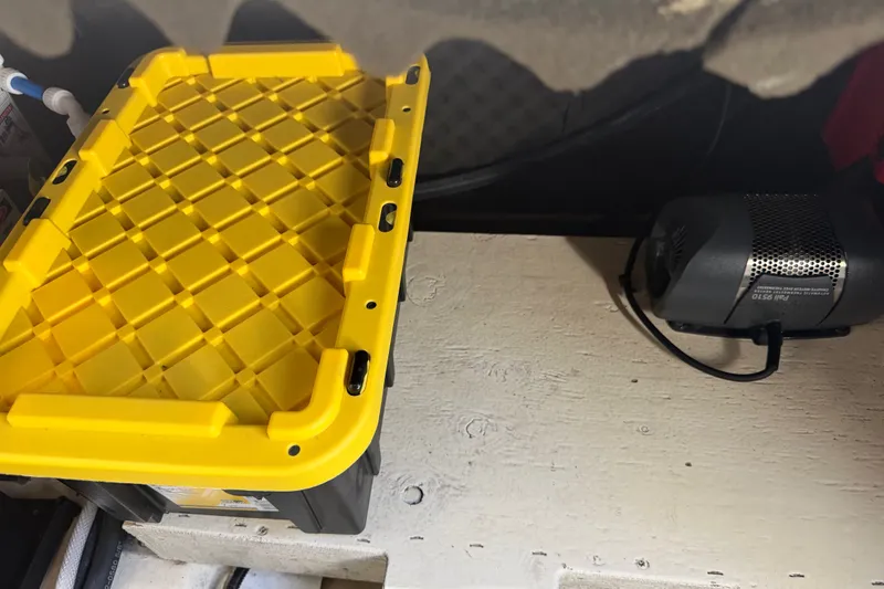 Slide: The Image of A yellow container and a small fan inside a boat. - 45