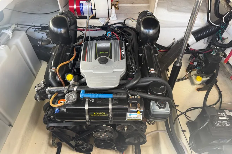 Slide: The Image of Engine compartment of a 2013 Sea Ray Sundancer 280 boat, featuring a MerCruiser 350 engine. - 42