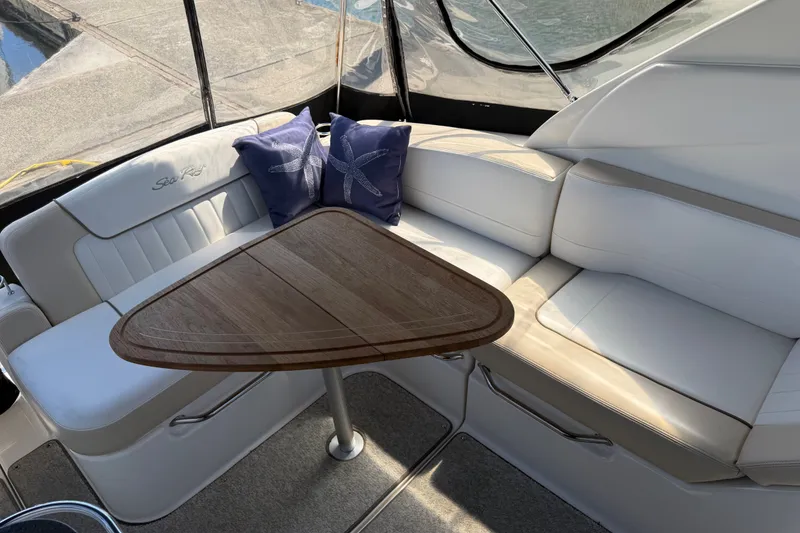 Slide: The Image of Luxurious interior of 2013 Sea Ray Sundancer 280 with elegant seating and wooden table. - 6