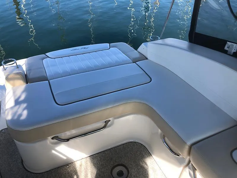 Slide: The Image of The image shows a cushioned seating area on a boat, surrounded by water. - 7