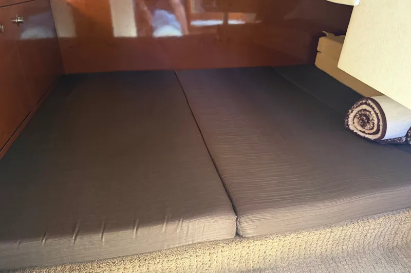 Slide: The Image of Interior cabin bed of 2013 Sea Ray Sundancer 280 yacht with rolled blanket. - 35