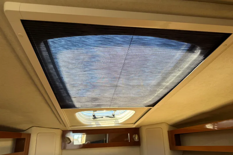 Slide: The Image of Interior view of 2013 Sea Ray Sundancer 280 cabin skylight with sunshade. - 26