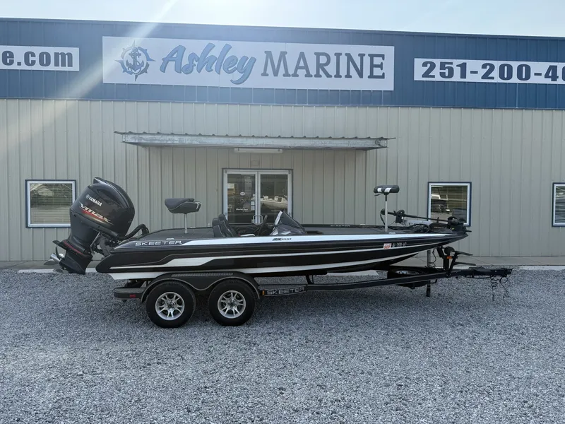 The Image of A 2018 Skeeter ZX200 boat on a trailer in front of an Ashley Marine building. - 1