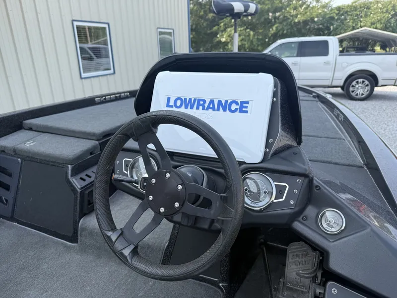 Slide: The Image of The image shows the cockpit of a 2018 Skeeter ZX200 with a Lowrance GPS system. - 2