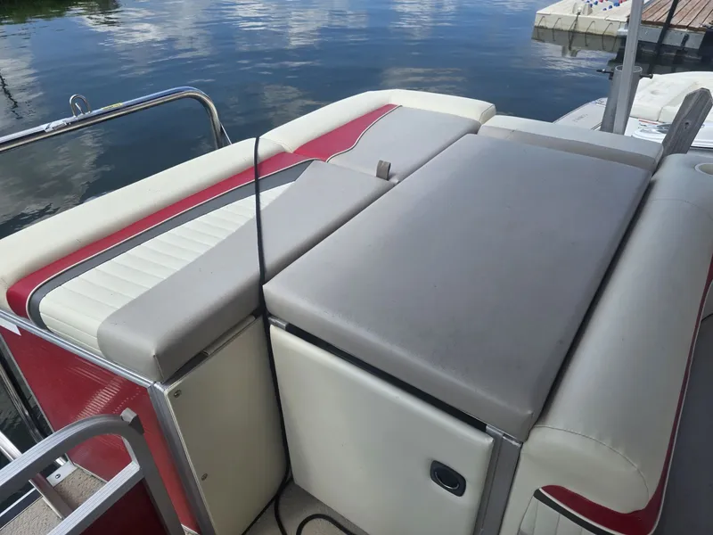Slide: The Image of The image shows the rear of a 2009 Bennington 2275SL pontoon boat with cushioned seating. - 9