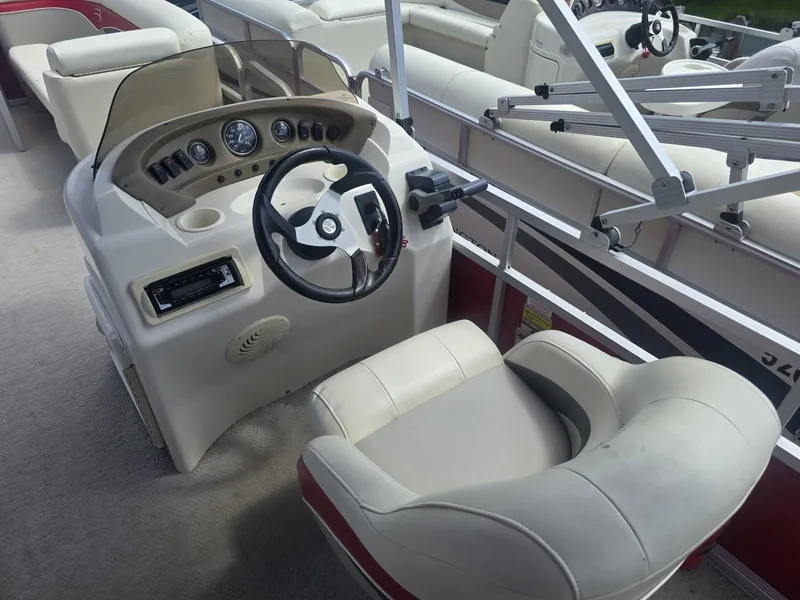 Slide: The Image of The image shows the cockpit of a 2009 Bennington 2275SL with a comfortable helm seat. - 8