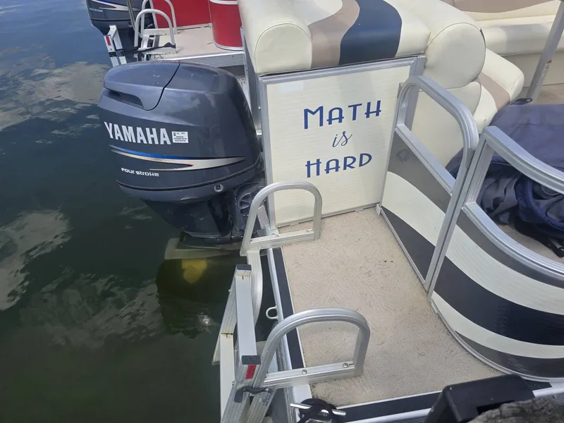 Slide: The Image of A 2008 Bennington 2050GL with a Yamaha outboard motor. Inscription reads: "Math is Hard." - 6