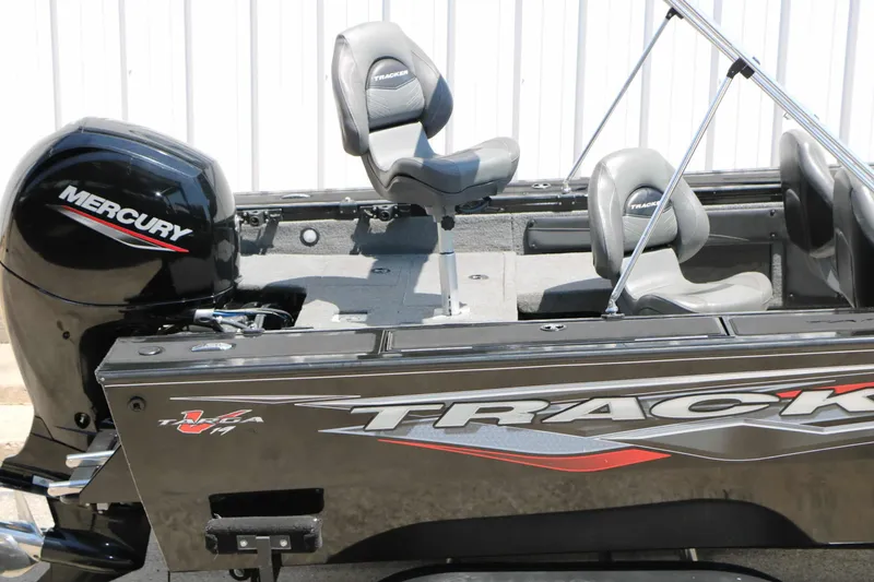 Slide: The Image of The image shows a 2020 Tracker Targa V 19 Combo boat with a Mercury engine. - 16