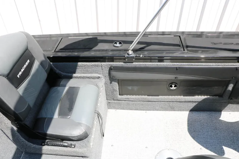 Slide: The Image of The image shows the interior of a 2020 Tracker Targa V 19 Combo boat with gray seating. - 46