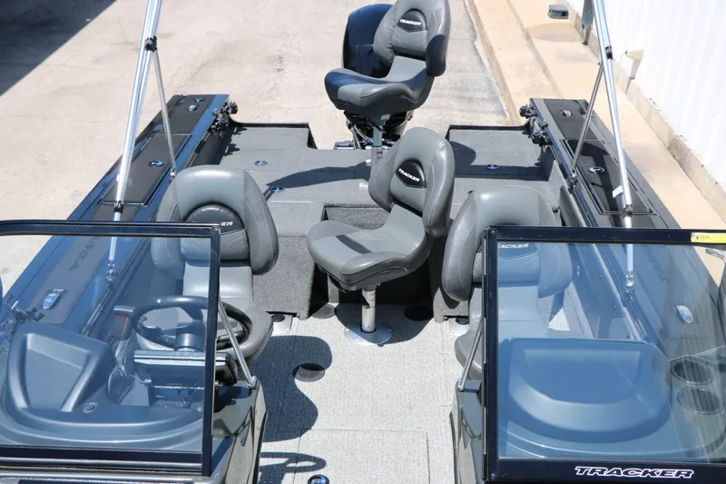 Slide: The Image of The image shows the cockpit of a 2020 Tracker Targa V 19 Combo boat with multiple seats. - 21