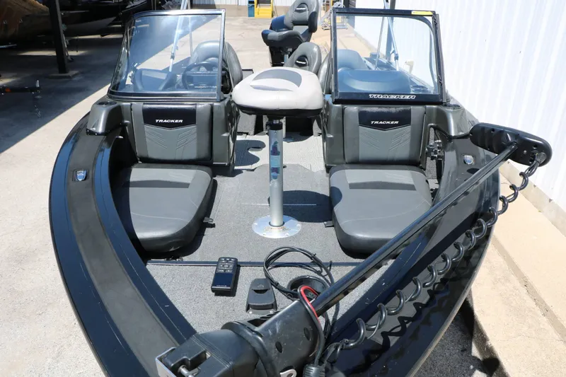 Slide: The Image of The image shows the cockpit of a 2020 Tracker Targa V 19 Combo boat with two seats. - 19
