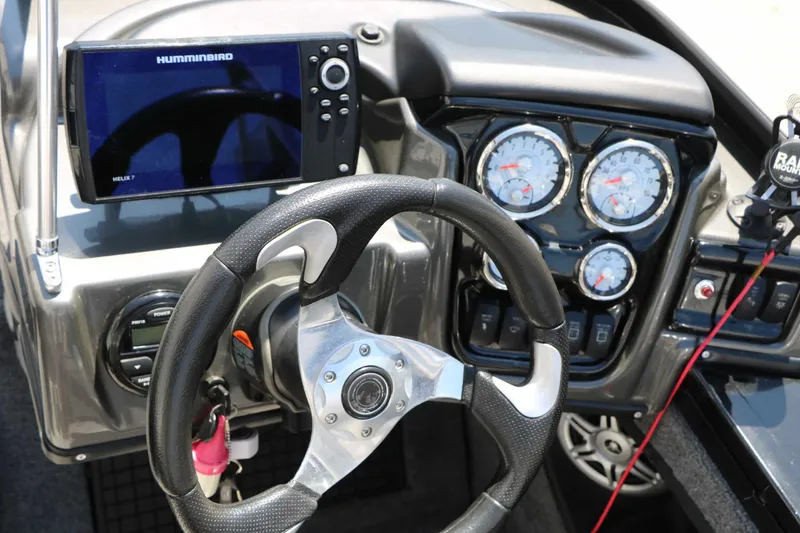 Slide: The Image of The image shows the dashboard of a 2020 Tracker Targa V 19 Combo with steering wheel and instruments. - 32