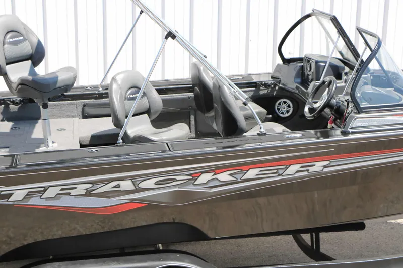 Slide: The Image of A 2020 Tracker Targa V 19 Combo with a black hull and red accents, featuring comfortable seating. - 17