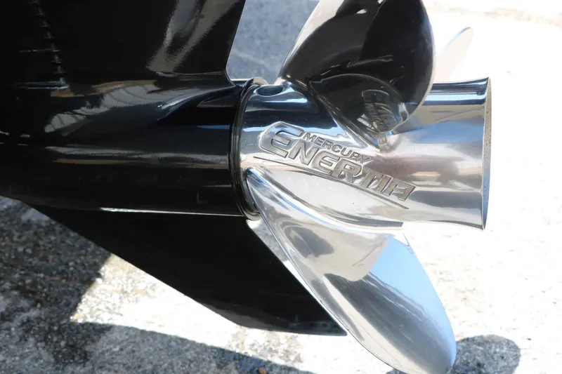 Slide: The Image of Close-up of a shiny propeller with "Mercury Enertia" inscribed on a Tracker Targa V 19 Combo. - 13