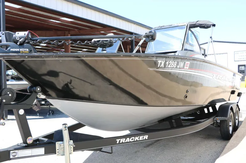 Slide: The Image of A black 2020 Tracker Targa V 19 Combo boat on a trailer, ready for transport. - 9