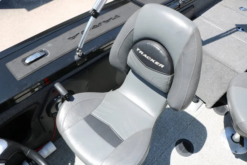 Slide: The Image of Interior of a 2020 Tracker Targa V 19 Combo with gray seats and a control console. - 40