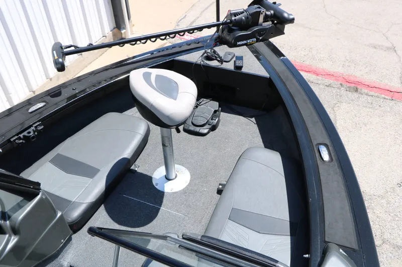 Slide: The Image of The image shows the bow of a 2020 Tracker Targa V 19 Combo boat with two gray seats and a Minn Kota trolling motor. - 24