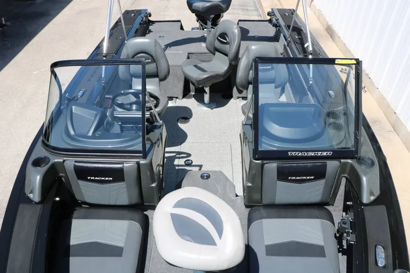 Slide: The Image of The image shows a 2020 Tracker Targa V 19 Combo boat with gray seats and windshields. - 20