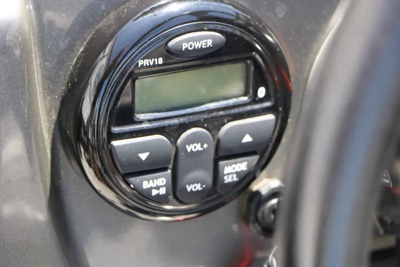 Slide: The Image of Close-up of a black control unit with buttons for volume and mode. - 34