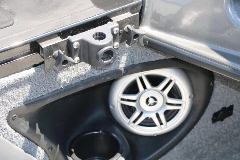 Slide: The Image of Close-up of a speaker and cup holder in a boat. - 48