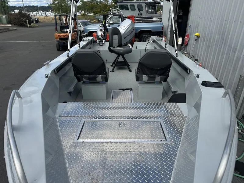Slide: The Image of A 2021 Hewescraft Open Fisherman 180 OF with aluminum deck, two seats, and an outboard motor. - 8