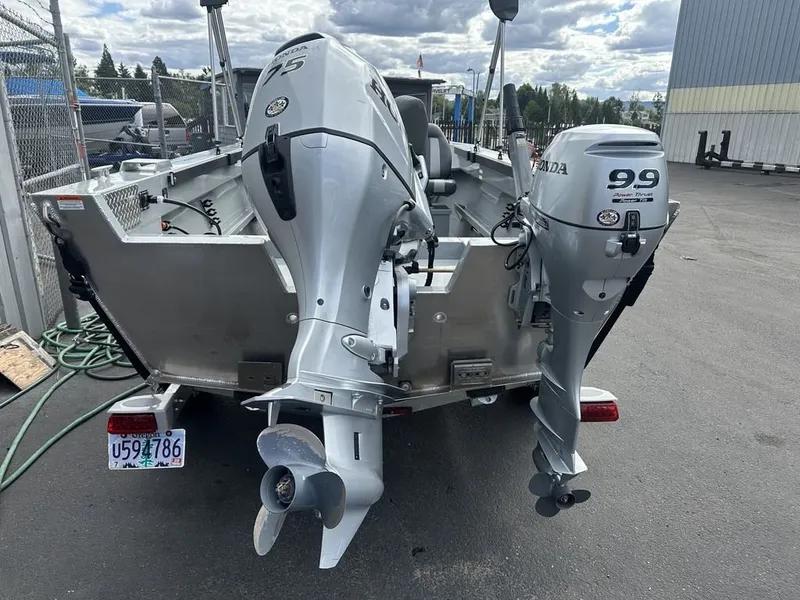 Slide: The Image of A 2021 Hewescraft Open Fisherman 180 OF with two outboard motors on a trailer. - 3