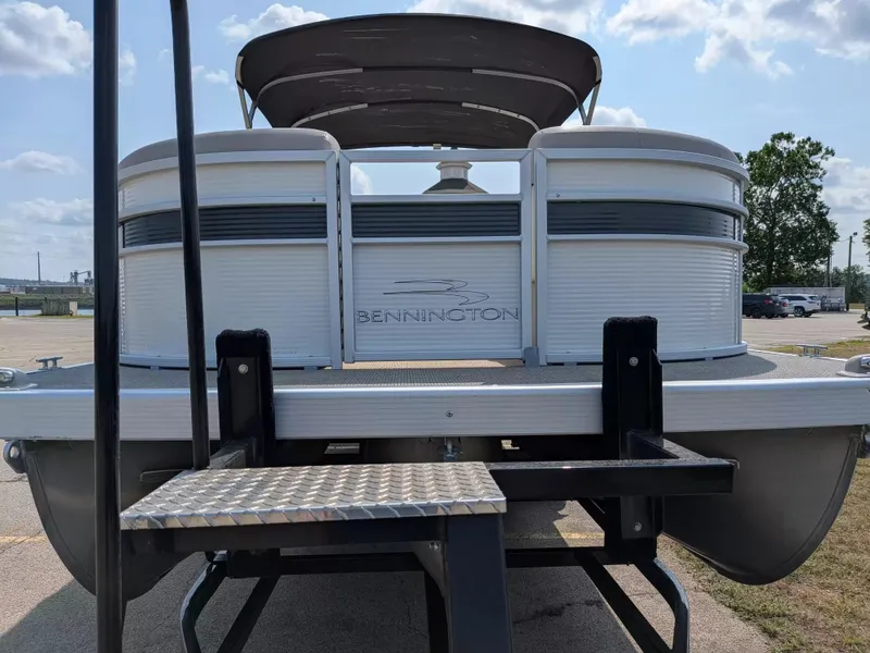 Slide: The Image of A 2019 Bennington 23 SSRXP pontoon boat on a trailer, ready for transport. - 5