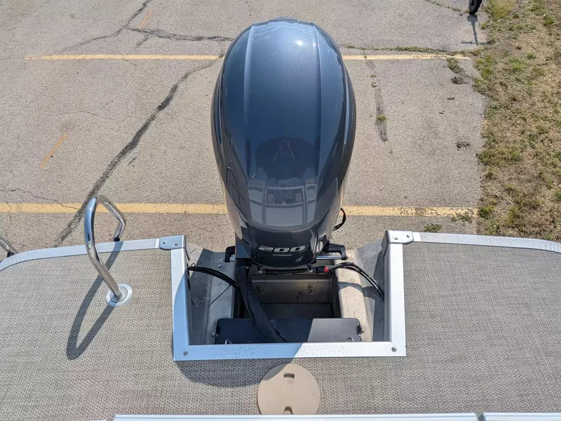 Slide: The Image of A 2019 Bennington 23 SSRXP with a 200 HP outboard motor, parked on a lot. - 12
