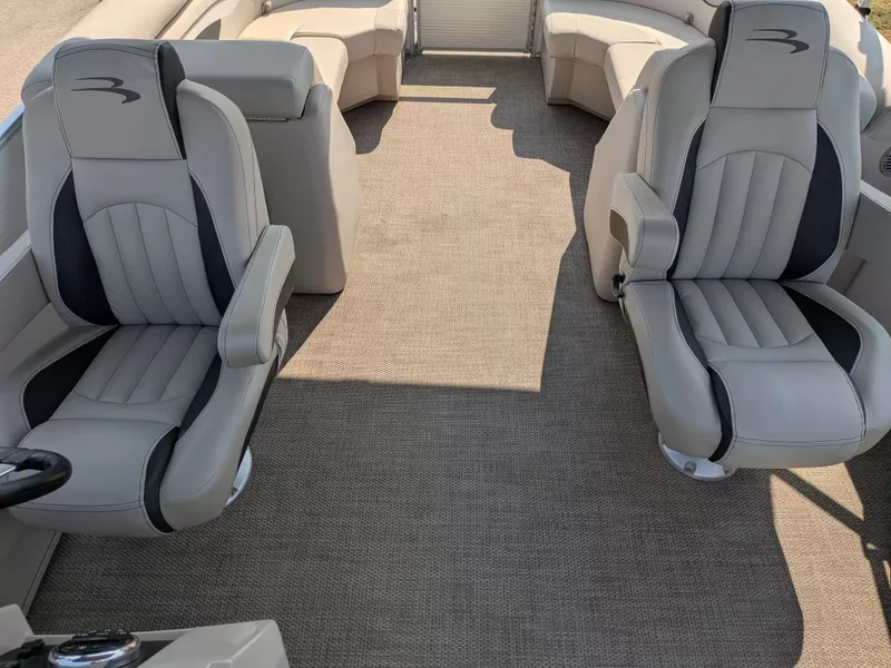 Slide: The Image of The image shows the interior of a 2019 Bennington 23 SSRXP with two upholstered seats. - 17