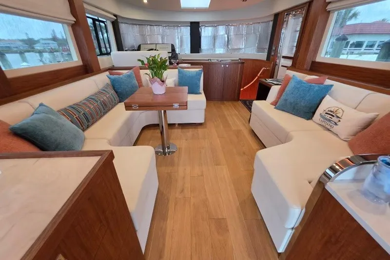 Slide: The Image of Luxurious interior of 2024 Sirena 58 Flybridge MY yacht with elegant seating and decor. - 73