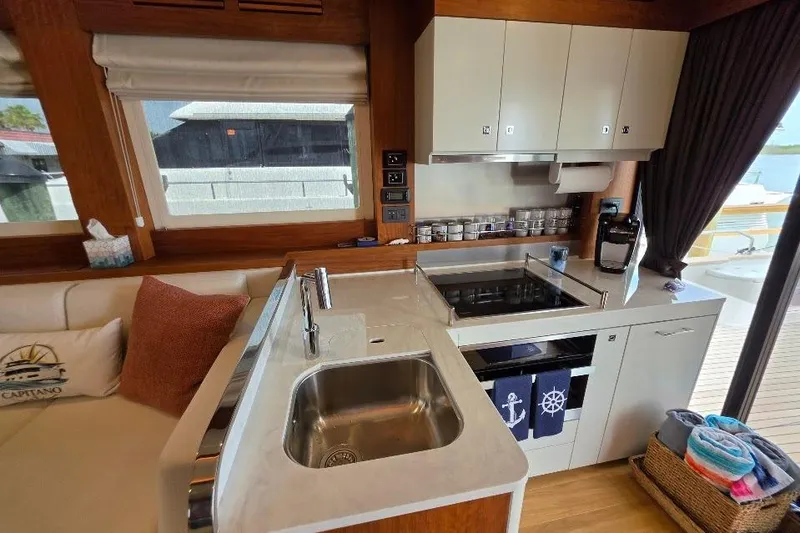 Slide: The Image of Luxurious 2024 Sirena 58 Flybridge yacht kitchen with modern amenities and elegant design. - 61