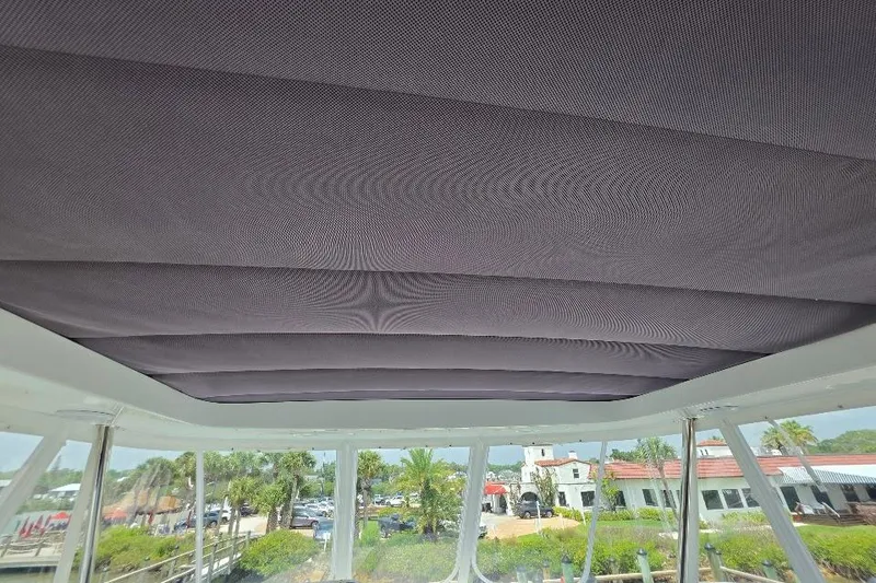 Slide: The Image of 2024 Sirena 58 Flybridge MY yacht interior ceiling view with scenic background. - 37